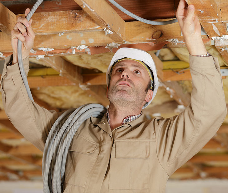 construction worker working on ceiling