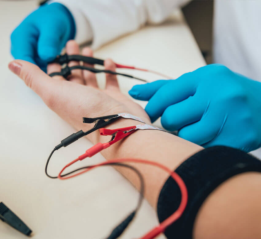 Close-up of doctor setting up an EMG & NCS test