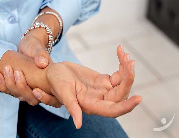patient holding wrist in pain