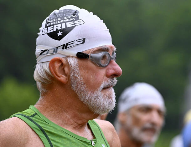 Man wearing goggles and swimming cap