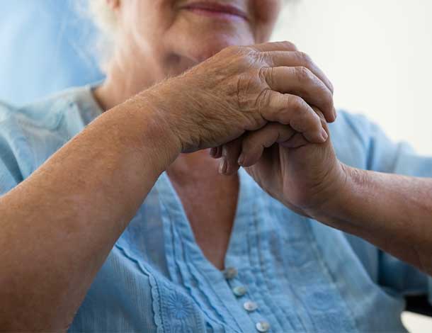 elderly woman seeking wrist joint replacement for arthritis
